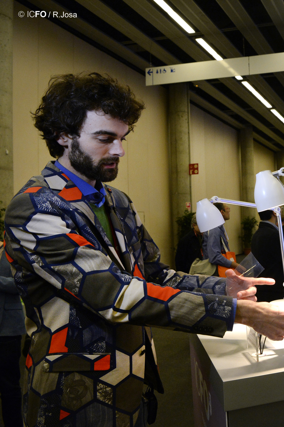 Researcher explaining graphene