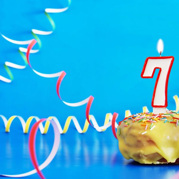 Birthday cupcake with number seven candle.