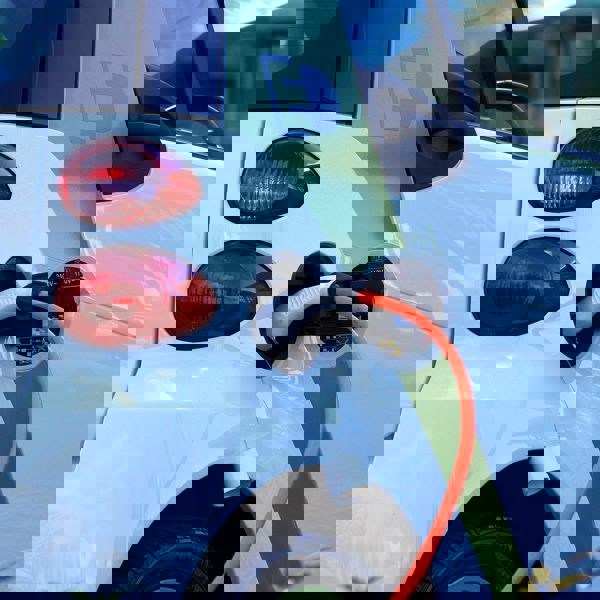 View of an electric car charging.  