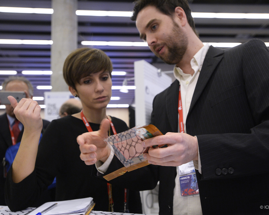 Researcher explaining his prototype at the Graphene Pavilion